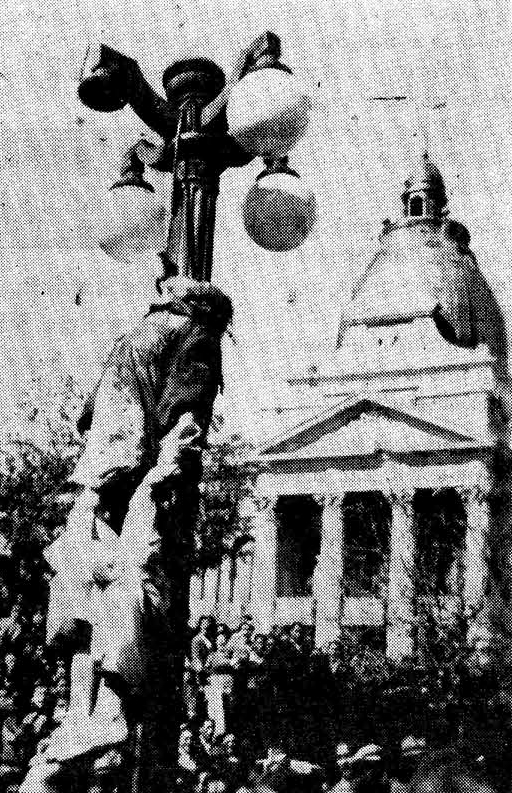 Villaroel hanging from a lamp post