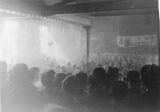 Jock Haston speaking at a mass rally in the Salle des Horticulteurs in Paris, March 1946